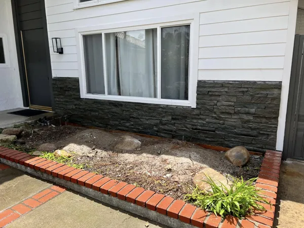 AJM Construction Services: stacked-stone and brick planter wall, Inland Empire hardscape project