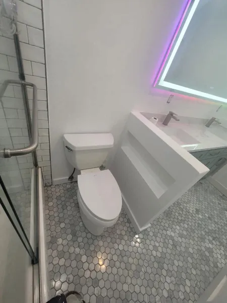 AJM Construction Services: bathroom remodel with glass shower and LED mirror in Canyon Lake